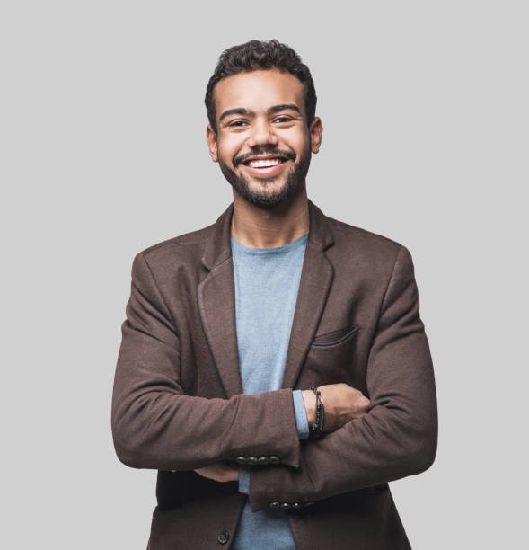 Cheerful young men looking to the camera. Isolated on gray background